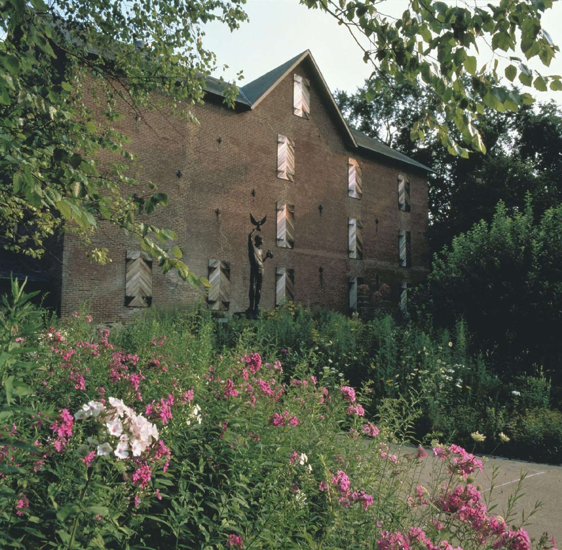 The old mill of the Brandywine Museum of Art among wildflowers